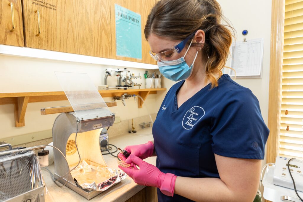 Cosmetic Dentistry in North Royalton, OH Shows our team working on a set of cosmetic dental implants.